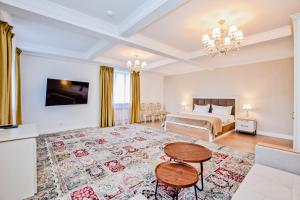 a bedroom with a bed and a table at Hotel Astoria, в самом центре города in Astana