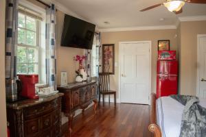 a kitchen with a red refrigerator and a wooden floor at National Harbor Suite 2 in Fort Washington