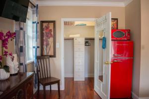 a red refrigerator in a room with a closet at National Harbor Suite 2 in Fort Washington