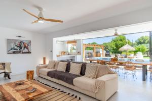 a living room with a couch and a table at Casa Lou Lou JAVEA in Benitachell