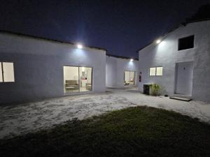 a white house at night with lights on it at CASA Les Deux R da Lagoa in Jijoca de Jericoacoara