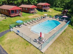an overhead view of a pool with chairs and a house at The Gold Eagle in Lake George +92 photos