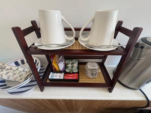 a table with two cups on top of it at Birch Tree House in Windermere