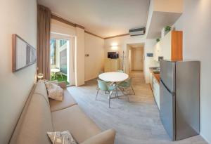 a living room with a couch and a table at Residence Capitol in Cattolica