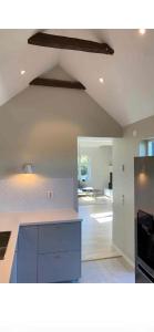 a kitchen with a blue island in a room at Tivoligatan in Höganäs
