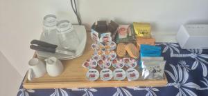 a shelf with cupcakes and other items on a table at Casa Marina in Balestrate