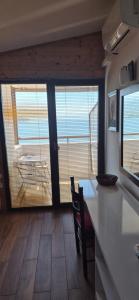 a kitchen with a counter and a table and chairs at Villa Malezan in Ohrid