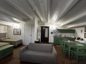 a living room with a couch and a table at Soleluna in Syracuse