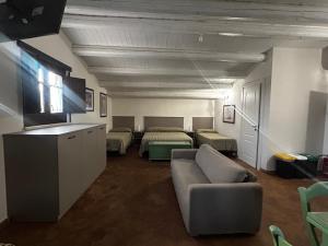 a living room with a couch and a bed at Soleluna in Syracuse