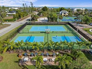 an aerial view of three tennis courts at Beachfront End Unit 302 2 Bikes beach gear in Sanibel
