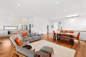 a living room with a couch and a table at Dunes at Tomakin in Tomakin