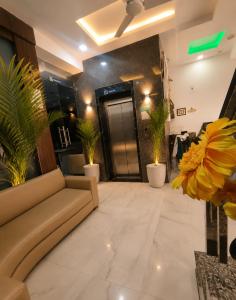 a lobby with a couch and some potted plants at Hotel Star Grand - Premium Budget Hotel Near Taj mahal, in Agra
