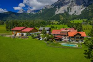 an aerial view of a resort in the mountains at Minzlhof in Ramsau am Dachstein