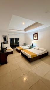 a bedroom with two beds in a room at hotel turqueza inn in Armenia +102 photos