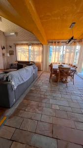 a living room with a couch and a table at Casa de campo en Punta Ballena in Punta del Este +33 photos