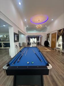 a pool table in the middle of a room at house chito in Tsqaltubo