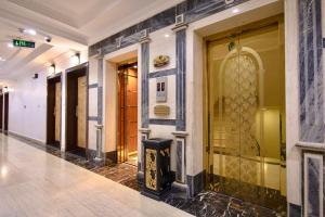 a row of doors on a building in a hallway at شقق راف التميز in Umm Salam