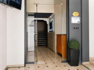 a hallway in a building with a stair case at Corner Park Suites City Center Corlu in Çorlu