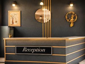 a reception desk with a sign that reads reception at Corner Park Suites City Center Corlu in Çorlu