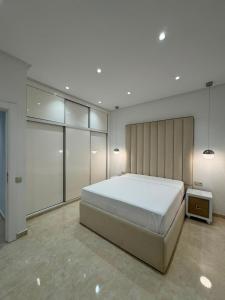 a bedroom with a large bed in a room at Marina Puerto in Marina Smir