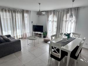 a living room with a table and a couch at Altea Lighthouse in Altea