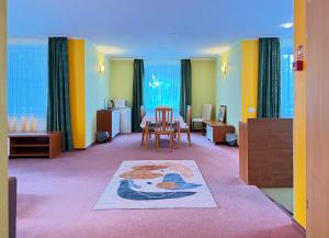 a room with a table and a dining room at Lucky Fish Jurmala in Jūrmala +71 photos