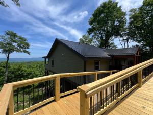 a house on a deck with a view at Viewtopia in Beech Mountain