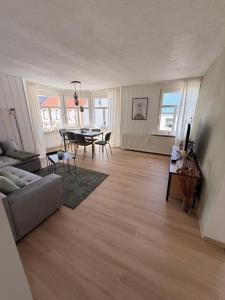 a living room with a couch and a table at StadtQuartier Gardelegen in Gardelegen