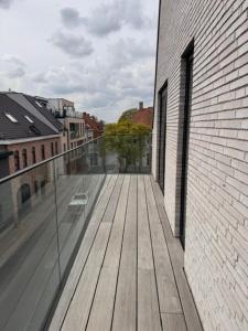 a view of a wooden deck on a building at The Corner-GILBERT in Oedelem