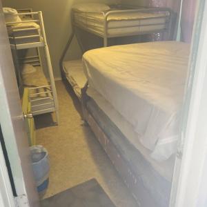 a room with two bunk beds in a room at ARMANI MANOR Rustic UNIT 2 in Wildwood