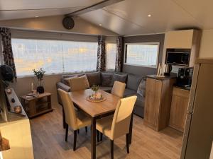 a dining room and living room in a caravan at Tiny House in Jukkasjärvi in Jukkasjärvi