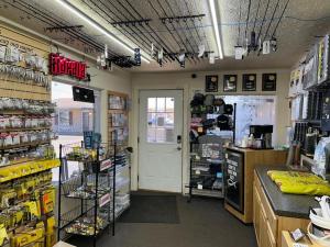 a store aisle with a grocery store with a door at The Last Resort in Sault Ste. Marie