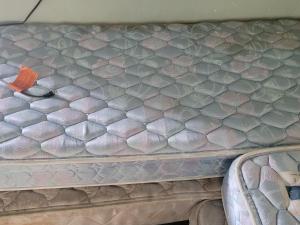 a bed in a van with a bug on it at ARMANI MANOR UPSTAIRS UNIT 3 quaint rustic 1br in Wildwood