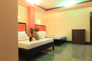 Postel nebo postele na pokoji v ubytování RSG Microhotel