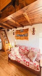 a large bed in a room with a staircase at Gallio Appartamento con splendida vista in Gallio