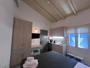 a kitchen with a bed and a sink in a room at Kea Harbor 1 in Korissia