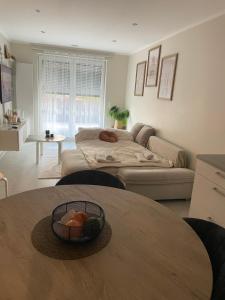a living room with a bed and a table at studio siesta in Pétange