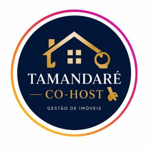a logo for a house with a pair of scissors at Kitnet Tijolo Ecológico 02 in Tamandaré