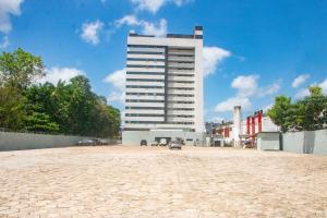 a large white building in the middle of a street at Holiday Inn Express Belem Ananindeua by IHG in Belém
