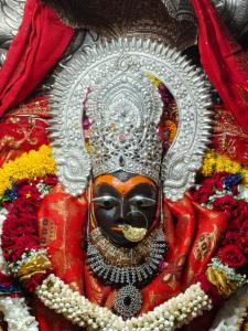 a statue of a person wearing a mask at Shiddi pelesh yatri niwas in Maihar