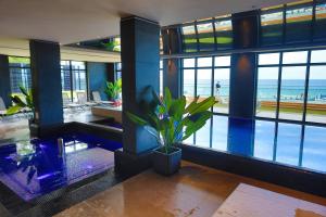 a living room with a view of the ocean at Baltic Infinity Suite 413 - SPA & Pool Access in Międzyzdroje