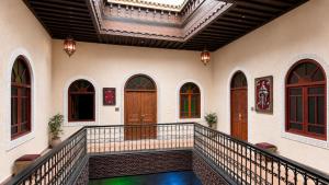 a balcony of a house with a pool at Riad Zyna in Meknès