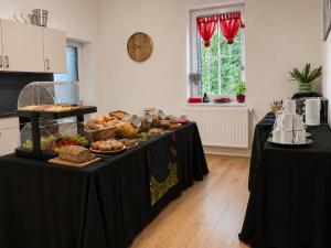 a buffet of food on a table in a room at Elements Apartments & Renata in Božičany