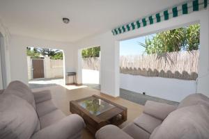 a living room with a couch and a coffee table at Alba Solis in Vejer de la Frontera