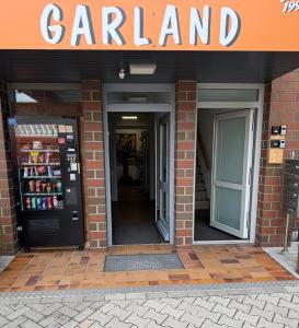 an entrance to a parking garage with a vending machine at Garland-Rooms in Bremen