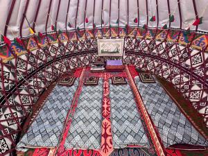 a building with a clock on top of it at Yurt house in Tong +18 photos