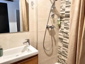 a bathroom with a shower and a sink at Résidence de Noëlle in Canet-en-Roussillon +43 photos