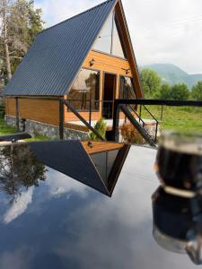a house with a solar roof on top of a table at Twenty 23 Cottages,kazbegi 1 in Kazbegi
