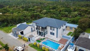 an aerial view of a house with a swimming pool at Kumnandi Modern Suite in Beacon Bay