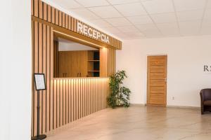 a lobby with a sign that reads rec room at RS Hotel in Rimavská Sobota